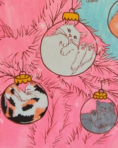 an ornament is hanging from a christmas tree with cats and kittens on it