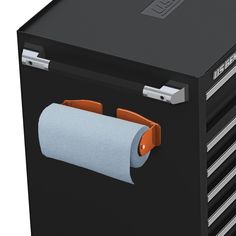 a black box with two rolls of toilet paper on the front and an orange handle