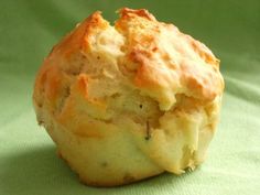 a close up of a muffin on a green surface