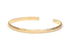 "Perfect for stacking or wearing alone as a dainty solid gold bracelet, this 14k floral bracelet features a sleek fit with a timeless botanical pattern. ►Our production time on custom orders averages 1-5 business days during off peak times, however we gladly will try to accommodate rushed and same day order requests. If you place a rushed order or same day request, please contact us through a convo or give us a call, as orders can sometimes take a bit to show up on our \"order page\" and technol Adjustable Etched 14k Gold Jewelry, Adjustable 14k Gold Etched Jewelry, Elegant Etched Yellow Gold Bracelet, Elegant Adjustable Jewelry With Engraving Option, Elegant Engraved 14k Gold Cuff Bracelet, Elegant Etched Yellow Gold Cuff Bracelet, Elegant Adjustable Bangle With Engraving Option, Elegant Adjustable Cuff Bracelet With Engraving Option, Elegant Etched Cuff Bracelet For Anniversary