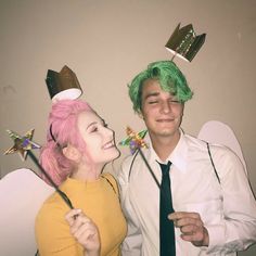 a man and woman dressed up in costumes