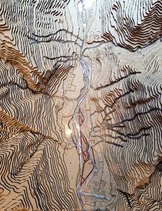 an intricately carved piece of wood with lines on it