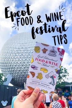 the epcot food and wine festival tips booklet is held up in front of disney world