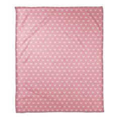 a pink blanket with white stars and hearts in the center on a white background,