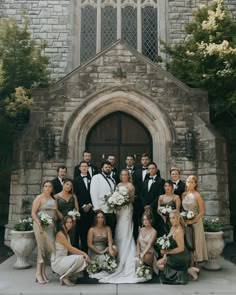 a group of people standing in front of a church