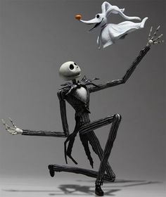 a skeleton is playing with a ball in front of a white ghost on a gray background