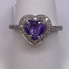 a heart shaped amethorate and diamond ring