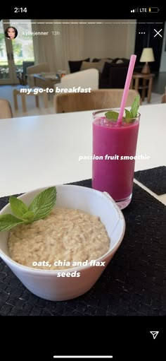 a bowl of oatmeal next to a glass with a pink smoothie in it