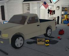 a truck is parked in front of a house with tools and other items on the ground