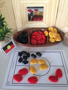 a game board with rocks and candy on it