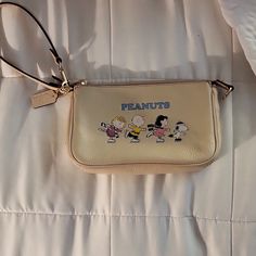 Small Coachxpeanuts Limited Edition Bag. Never Used, Still Has Tags Coach Beige Bag With Zipper Pouch, Coach Cream Clutch Bag, Coach Bag With Zipper Pouch For Everyday Use, Coach Bags With Zipper Pouch, Coach Bags With Zipper Pouch For Everyday, Limited Edition Bag, Coach Bag, Small Bags, Wristlets