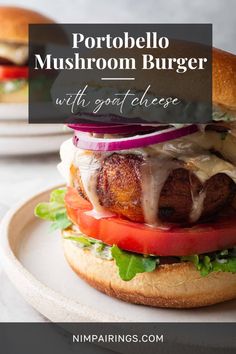 a close up of a burger on a plate with the words portabello mushroom burger with goat cheese