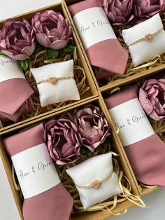 four pink and white boxes with flowers in them