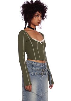 cuz nothing like the woods to put you in the mood. This long sleeve top has a ribbed construction, contrast colored stitching seam design, peekaboo lace detailing, a scoop neckline, a decorative bow on the front, long sleeves, and a cropped fit. Green Long Sleeve Top With Lace Trim, Fitted Long Sleeve Top With Contrast Stitching, Green Long Sleeve Top For Spring Layering, Spring Green Long Sleeve Top For Layering, Journaling Thoughts, Current Mood Clothing, Hippie Grunge, Windsor Smith, Pride Outfit