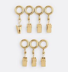 six pairs of gold - plated metal clasps with rings and hooks on each side