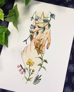 a drawing of a hand with flowers on it