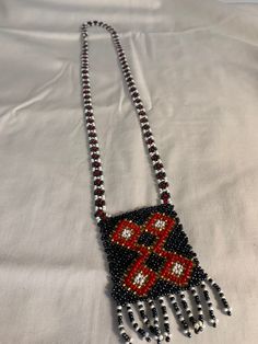 Antique handmade beaded necklace, African ethnic craftsmanship black and red Traditional Handwoven Beads For Jewelry Making, Handmade Black Necklaces For Festivals, Bohemian Rectangular Beaded Necklaces For Festivals, Traditional Handwoven Beaded Necklaces For Festivals, Handmade Black Necklace For Festivals, Traditional Handmade Long Beaded Necklace, Bohemian Rectangular Beaded Necklace, Traditional Handwoven Necklaces With Round Beads, Handmade Black Jewelry For Festivals