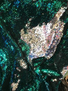 the sequins on this dress are green and blue, with silver flakes