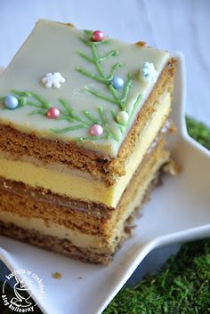 three layered cake sitting on top of a white plate