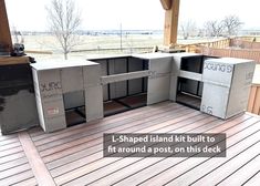 an outdoor kitchen is being built on a deck