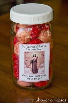 a glass jar filled with red and pink candies