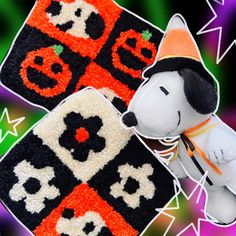 two halloween themed rugs with a dog wearing a hat