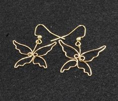 Sleek handmade butterfly-shaped wire earrings. Handmade Butterfly Metal Earrings, Handmade Metal Butterfly Earrings, Butterfly Party Earrings With Ear Wire, Wire Butterfly Earrings, Wire Butterfly, Handmade Butterfly, Butterfly Earrings, Wire Earrings, Jewelry Earrings Dangle