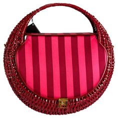 Presenting an incredible pink wicker Atelier Versace bag designed by Donatella Versace. From the Haute Couture collection, this bag debuted on the season's runway as part of Look 20, modeled by Carmen Kass. This fabulous round bag is constructed of pink-coated wicker and features silk satin flaps on both sides and gold-tone Greek key closures and hardware. Never worn before, this fabulous Atelier Versace bag is made complete with the original tags. Add this rare and unique bag to your collection Bag Versace, Versace Bags Women, Pink Versace Bag, Versace Shopping Bag, Versace Pink Mini Dress, Turquoise Bag, Carmen Kass, Versace Leather Jacket, Feather Heels