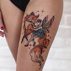 a woman's thigh with tattoos on it