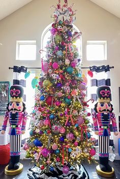 a christmas tree decorated with nutcrackers and ornaments