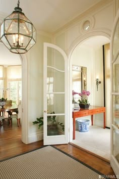 an entry way leading to a dining room and living room