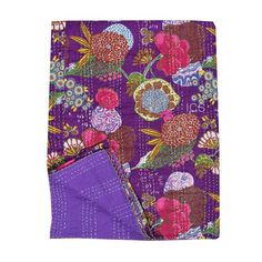 a purple and pink flowered cloth with a blue pocket on the bottom, next to it