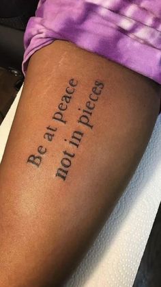 a person with a tattoo on their leg that says, be the peace and not the peace