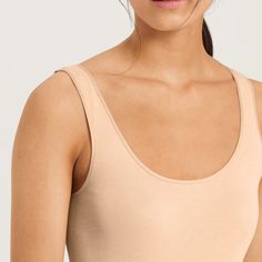 The HANRO Cotton Seamless Tank Top is a basic from HANRO of Switzerland; the best Cotton Seamless ever. Featuring seamless sides, hemless bottom and tailored from 100% cotton softened using an innovative new mercerization technique. This stylish and modern women's tank features a satin trimmed scoop neckline and straps for easy layering, plus the versatility to wear as a stylish top. Style # 071604 Style: Seamless Tank Top Fabric: 100% Cotton Design: This camisole has wide straps and delicate elastic satin edging. Seamless and hemless, it's perfect to wear as a foundation garment under layers or on its own. Fit and Tips: Size XL will contain side seams. Fits large, recommend sizing down. Mercerized cotton is the highest level of cotton and does not shrink when washed. Black Camisole, Stylish Top, Top Fabric, Wide Straps, Leggings Shop, Bra Sizes, Scoop Neckline, Womens Tank, Modern Woman