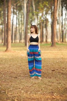 These cute hippie pants are colorful pants and handmade with rayon fabric which make them super comfy to wear. They have an elastic waist and elastic ankles. The two pockets are fitted with decorative strings. These trousers are are perfect for relaxing at home, working out, yoga running, beachwear and general casual wear. Also recommended for Thai massage, dance and festivals. Lannaclothesdesign products are uniquely designed and latest fashion trends. You can choose from many different colors Casual Full-length Harem Pants For Beach, Casual Multicolor Wide-leg Harem Pants, Full-length Harem Pants With Elastic Waistband For Vacation, Summer Loose Fit Ankle-length Harem Pants, Summer Harem Pants With Loosely Fitted Hips, Casual Multicolor Full-length Harem Pants, Casual Multicolor Full Length Harem Pants, Multicolor Cotton Wide Leg Hippie Pants, Bohemian Blue Wide Leg Pants With Pockets