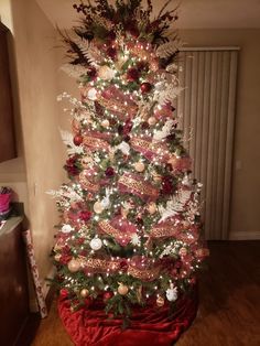 a christmas tree decorated with red and white ornaments