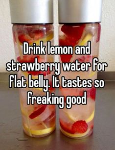 two cups with strawberries and lemon water for flat belly, it tastes so freaking good