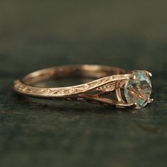 an engagement ring with a blue topazte stone