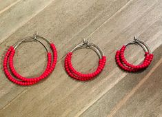 *Red Hoop Earrings  *Stainless Steel *Available in 3 sizes These cute hoops are just in time for Valentine's Day.  They are stainless steel, light, and come in 3 sizes- small (20 mm), medium (30 mm), large (40 mm).  They are also available in the shop in pink and purple.   Your hoops will be packaged neatly in a drawstring organza bag with deepest appreciation to all customers. Seed Bead Hoop Earrings, Minimal Hoop Earrings, Valentines Day Earrings, Red Hoop Earrings, Wood Hoop Earrings, Bead Hoop Earrings, Boho Hoop Earrings, Steel Light, Turquoise Hoop Earrings