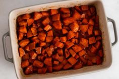 a casserole dish filled with cooked sweet potatoes