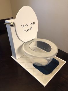 a toilet that is sitting on top of a table