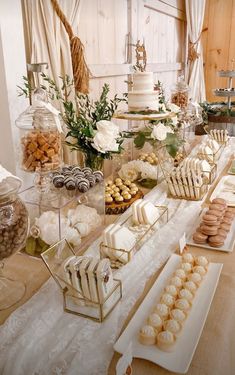 a table filled with lots of desserts and pastries on top of each other