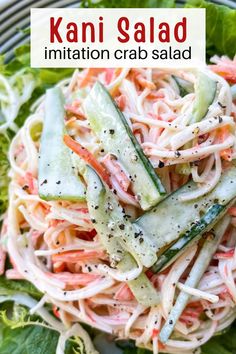 a salad with carrots, cucumbers and parsley in it on a plate