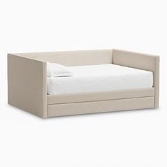 the daybed is made up to be used as a child's bed or toddler's bed