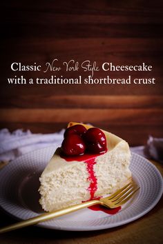 a slice of cheesecake on a plate with cherries