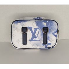 This stylish bag is crafted of Monogram canvas in white with a blue watercolor effect. The bag features a blue fabric adjustable shoulder strap and a front zipper pocket. The top zipper opens to a blue fabric interior with a patch pocket. Retail $1,790. Due to the rare and limited nature of the item, the asking price is higher than the MSRP. The Bronx New York, Gold Ounce, Watercolor Effects, Blue Watercolor, Stylish Bag, Blue Fabric, Monogram Canvas, Front Zipper, Louis Vuitton Monogram