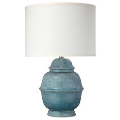 a blue lamp with a white shade on it