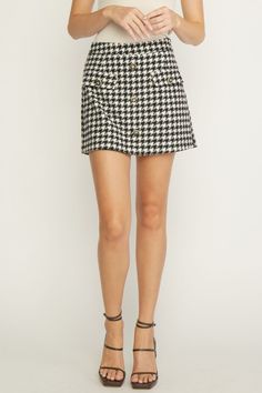 Houndstooth mini skort Brand: Entro Style: P19010 Fabric: 80% POLYESTER 20% WOOL Details: Houndstooth mini skort. Lined. Woven. Non-sheer. Mediumweight. 5'10" and wearing size Small. matching blazer style # J19009 Black Houndstooth Mini Skirt For Fall, Houndstooth Mini Skirt For Work, Fall Black Houndstooth Mini Skirt, Houndstooth Mini Skirt For Spring, Chic Houndstooth Mini Skirt, Houndstooth Mini Skirt For Workwear, Chic Black Houndstooth Mini Skirt, Chic Black Mini Skirt With Houndstooth Pattern, Houndstooth Pattern Mini Skirt For Workwear