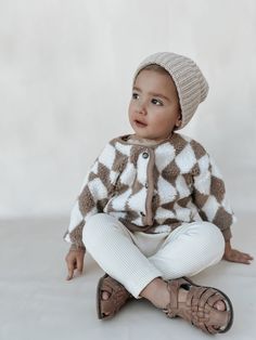 100% organic cotton unique, cozy, soft, neutral, sustainable. Our Teddy Coat is a MUST! Want to add a little pop or flare to your child's neutral wardrobe? This is the perfect piece to accessorize and add a little personality to your little one's everyday style. Comfy, cozy, warm, all our favorite things! Machine or hand wash, cold cycle, with like colors. Turn inside out, gentle detergent, do not bleach. Hang to dry. This piece fits true to size. Cute Cotton Outerwear For Loungewear, Cute Cotton Loungewear Outerwear, Cute Cotton Outerwear For Playtime, Cute Cotton Outerwear For Play, Cream Soft Knit Cotton Outerwear, Playful Fall Playwear For Babies, Cream Cotton Outerwear With Soft Knit, Neutral Wardrobe, Baby Turban