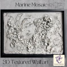 the 3d textured wall art is displayed in a black frame